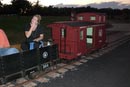 Julie Hill in front of the new Hillcrest Caboose...