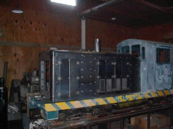 The #497, a former Bell Gardens owned loco that was built by Custom locomotive works. This picture is a few weeks old and the fabrication is not near complete but gives the idea of the drastic changes made to the locomotive. The old paint on the cab and lower chassis has been sanded in preparation for painting.