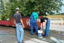 27_Both Alex's and John washing one of the boxcars