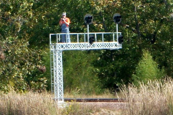 107_Chance Beams up on the signal tower at Lakeside with his camera.  Yeah, us photographers do crazy things!